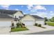 Charming townhome with attached garage and landscaped front yard on a sunny day at 2504 Heritage Loop # 2504, Myrtle Beach, SC 29577