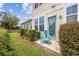Home exterior featuring a blue door, a matching chair, and neatly trimmed landscaping for curb appeal at 2504 Heritage Loop # 2504, Myrtle Beach, SC 29577