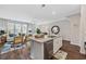 Open-concept kitchen featuring an island with granite countertops, stainless steel appliances, and adjacent living area at 2504 Heritage Loop # 2504, Myrtle Beach, SC 29577