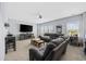 Spacious living room featuring a large sectional sofa, entertainment center, and ample natural light at 2504 Heritage Loop # 2504, Myrtle Beach, SC 29577