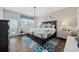 Tranquil main bedroom with hardwood floors, chandelier lighting and walkout to balcony at 2504 Heritage Loop # 2504, Myrtle Beach, SC 29577