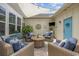 Comfortable patio with stylish seating, mounted television, and shade sail at 2504 Heritage Loop # 2504, Myrtle Beach, SC 29577