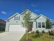 Charming single-Gathering home with light blue siding, white garage door, and manicured lawn at 2855 Riverboat Way, Conway, SC 29526