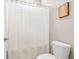 Bathroom with a toilet and white curtained shower at 314 Bumble Circle, Murrells Inlet, SC 29576