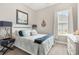 Comfortable bedroom with an accent anchor hanging on the wall and nautical themed decorations at 314 Bumble Circle, Murrells Inlet, SC 29576