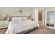 Bright bedroom with a walk-in shower and neutral color scheme at 314 Bumble Circle, Murrells Inlet, SC 29576