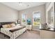 Cozy bedroom with large windows allowing for plenty of natural light at 314 Bumble Circle, Murrells Inlet, SC 29576