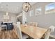 Bright dining room with wood table and views of the kitchen at 314 Bumble Circle, Murrells Inlet, SC 29576