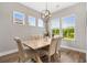 Dining room with natural light, wood table, and seating for six at 314 Bumble Circle, Murrells Inlet, SC 29576