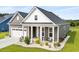 Attractive single-story house with well-kept lawn, front porch seating, and attached two-car garage at 314 Bumble Circle, Murrells Inlet, SC 29576