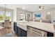Open concept kitchen with a large island, stainless steel appliances and access to the living room at 314 Bumble Circle, Murrells Inlet, SC 29576