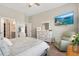 Comfortable main bedroom with a ceiling fan, sitting area and a television mounted on the wall at 314 Bumble Circle, Murrells Inlet, SC 29576
