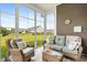 Cozy sunroom with outdoor views and comfortable seating at 314 Bumble Circle, Murrells Inlet, SC 29576