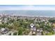 Aerial view of beach community with location pin highlighting proximity to ocean at 327 A Lakeside Dr., Surfside Beach, SC 29575