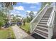 Beautiful backyard with stone patio, staircase, and inviting waterfront access at 327 A Lakeside Dr., Surfside Beach, SC 29575
