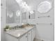 Bright bathroom featuring a double vanity with granite countertops, modern faucets and updated fixtures at 327 A Lakeside Dr., Surfside Beach, SC 29575