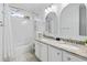 Bright bathroom with double vanity, granite countertops, and tub shower at 327 A Lakeside Dr., Surfside Beach, SC 29575