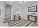 Bright entryway with a staircase and tasteful decor at 327 A Lakeside Dr., Surfside Beach, SC 29575