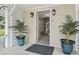 Inviting entryway with decorative plants and stylish light fixtures at 327 A Lakeside Dr., Surfside Beach, SC 29575