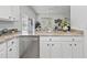 Kitchen with granite countertops, stainless steel dishwasher, and open view to the dining area at 327 A Lakeside Dr., Surfside Beach, SC 29575