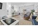 Open concept living and dining area with hardwood floors and ample natural light at 327 A Lakeside Dr., Surfside Beach, SC 29575