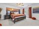 Inviting bedroom with a beach-themed mural, balcony access, and bright textiles, creating a serene retreat at 327 A Lakeside Dr., Surfside Beach, SC 29575