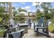 Relaxing outdoor seating area with Adirondack chairs overlooking the serene water at 327 A Lakeside Dr., Surfside Beach, SC 29575
