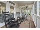 Inviting covered porch featuring classic rocking chairs and serene views at 327 A Lakeside Dr., Surfside Beach, SC 29575