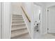 Carpeted staircase leading to the second floor with a view of the bathroom at 327 A Lakeside Dr., Surfside Beach, SC 29575