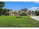 A lush lawn with a tranquil pond leading to an apartment building with a dock at 328 Waterside Dr., Myrtle Beach, SC 29577