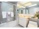 Well-lit bathroom with a shower, vanity, and ample storage at 328 Waterside Dr., Myrtle Beach, SC 29577