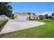 Charming two-story home boasts lush lawn, brick accents, and an attached two-car garage at 328 Waterside Dr., Myrtle Beach, SC 29577