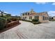 Elegant home with a long driveway, well-manicured landscaping, and brick accents creating a welcoming entrance at 328 Waterside Dr., Myrtle Beach, SC 29577