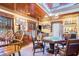 Game room features wood ceiling, game table, pinball machine, and vintage decor at 328 Waterside Dr., Myrtle Beach, SC 29577