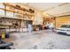 Spacious garage features storage shelving, a work area, and plenty of room for vehicles at 328 Waterside Dr., Myrtle Beach, SC 29577
