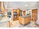 Spacious kitchen with wood cabinets, stainless steel appliances, granite countertops, and tile flooring at 328 Waterside Dr., Myrtle Beach, SC 29577