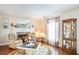 Cozy living room with a fireplace, hardwood floors, and tasteful décor providing a comfortable atmosphere at 328 Waterside Dr., Myrtle Beach, SC 29577