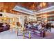 Open concept living area with wood ceiling, leather sofas, and seamless access to kitchen and dining areas at 328 Waterside Dr., Myrtle Beach, SC 29577