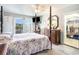 Main bedroom with a four-poster bed, walk-in closet, and access to a balcony at 328 Waterside Dr., Myrtle Beach, SC 29577