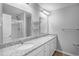 Bathroom featuring double sinks with granite countertops and a glass-enclosed shower at 3547 Ladybank Loop, Myrtle Beach, SC 29577