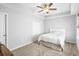 Bright bedroom featuring a ceiling fan and double door closet at 3547 Ladybank Loop, Myrtle Beach, SC 29577
