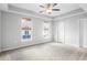 Spacious bedroom with ceiling fan and lots of natural light from windows at 3547 Ladybank Loop, Myrtle Beach, SC 29577