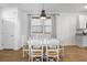 Bright dining area with a round table, modern lighting, and white-painted walls at 3547 Ladybank Loop, Myrtle Beach, SC 29577