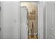 Convenient laundry area with stacked washer and dryer and storage shelves at 3547 Ladybank Loop, Myrtle Beach, SC 29577