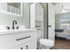 Bright bathroom features modern vanity with black fixtures and a combo toilet/storage unit at 3935 Gladiola Ct. # 302, Myrtle Beach, SC 29588