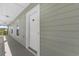 Exterior shot of a white apartment door with the number 302 at 3935 Gladiola Ct. # 302, Myrtle Beach, SC 29588
