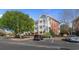 Well-maintained condo buildings with red brick, white columns, parking, and lush greenery at 3935 Gladiola Ct. # 302, Myrtle Beach, SC 29588