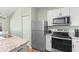 Modern kitchen with stainless steel appliances, white cabinetry, and sleek countertops at 3935 Gladiola Ct. # 302, Myrtle Beach, SC 29588