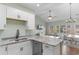 Bright kitchen featuring stainless sink, granite countertops, and white cabinets at 3935 Gladiola Ct. # 302, Myrtle Beach, SC 29588