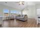 Bright living room with vaulted ceiling, ceiling fan, and lots of natural light at 3935 Gladiola Ct. # 302, Myrtle Beach, SC 29588